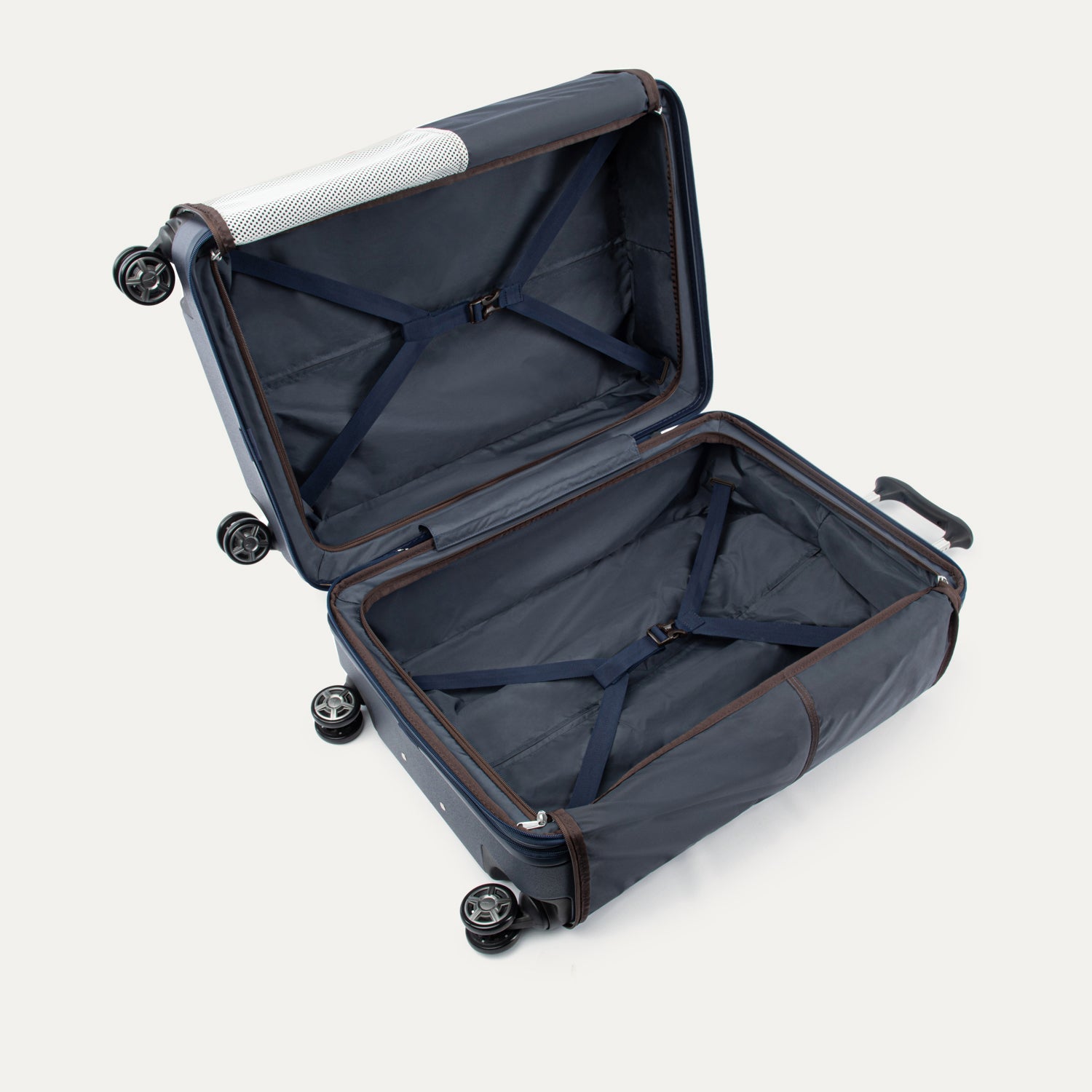 Open navy blue suitcase with black wheels on a white background