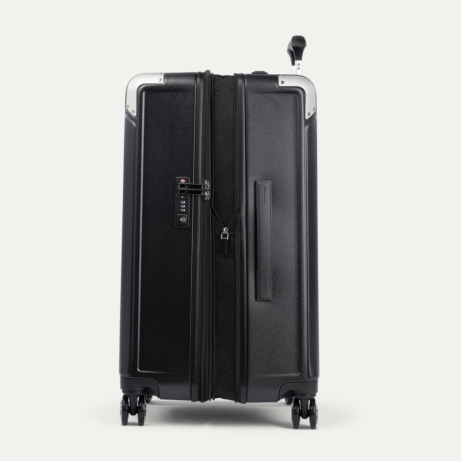 Side view of black suitcase expanded and with a tsa lock on a white background