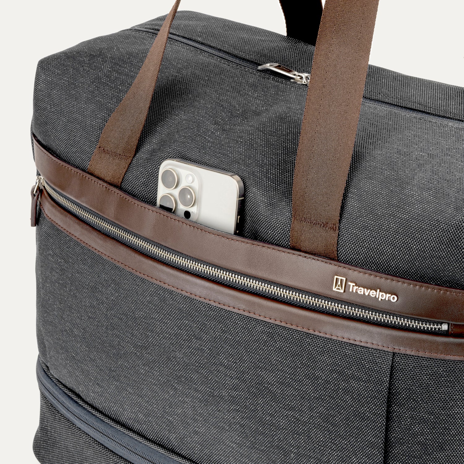 Grey weekender displaying phone in QuickSlip™ pocket on a white background