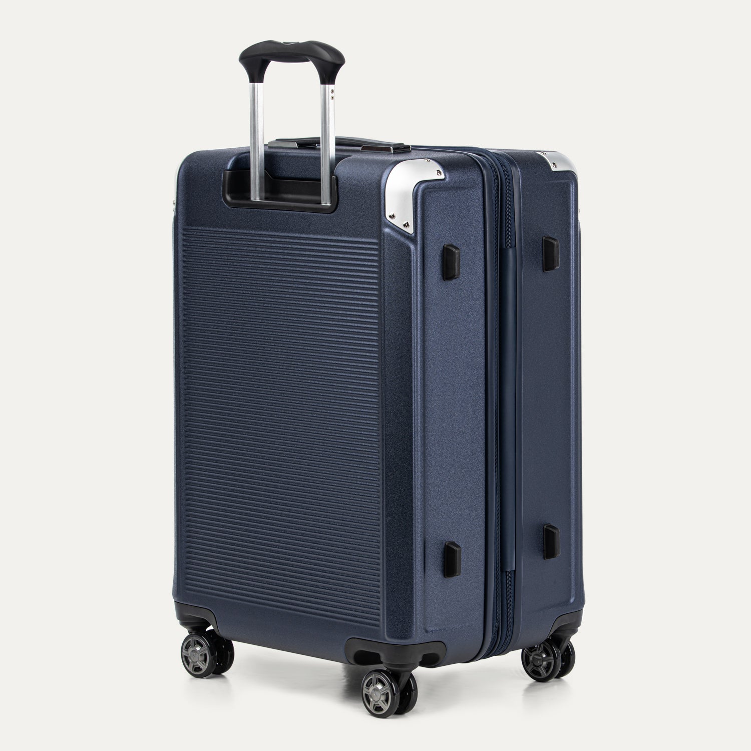 True navy suitcase with a textured surface on a white background