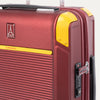 Detail view of Travelpro x Surgeon Check-In Spinner in Daring Red, highlighting logo, yellow trim, and integrated TSA Approved Lock.
