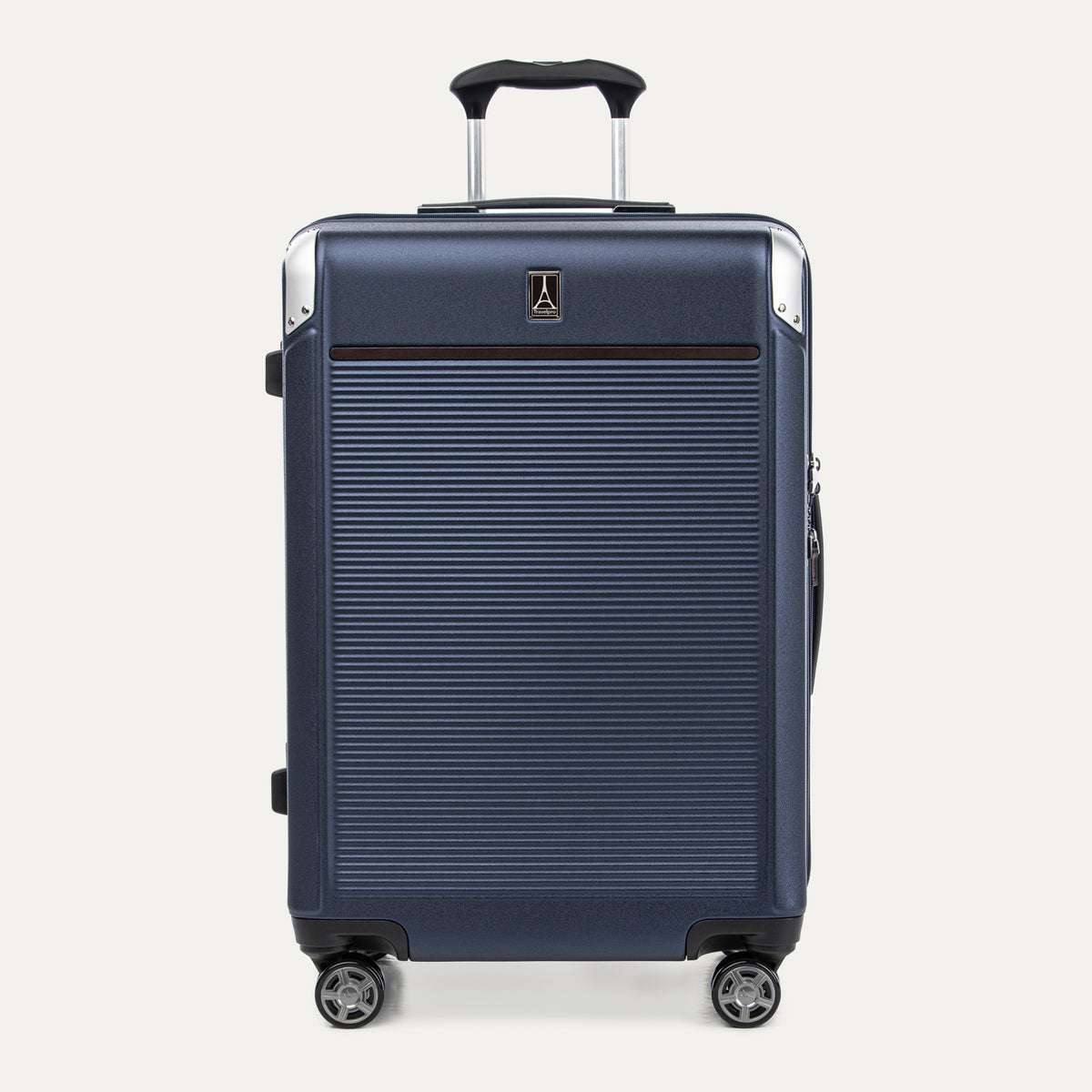 Front view of Travelpro Platinum® Elite Hardside Medium Check-In Expandable Spinner in True Navy, featuring grooved polycarbonate shell with chrome corner armor.
