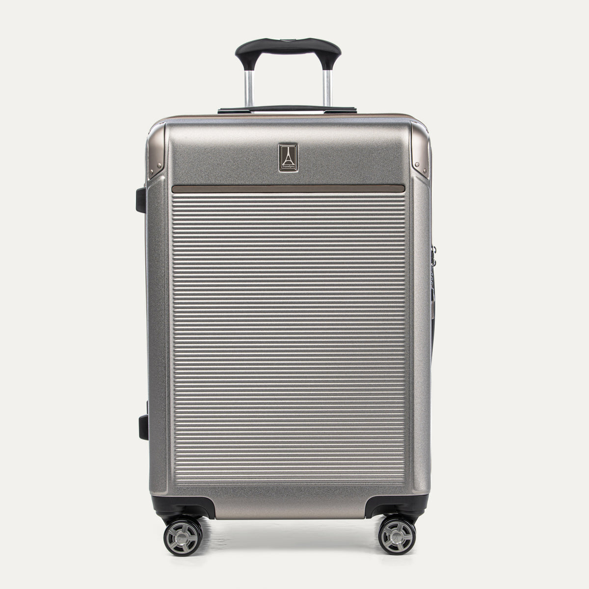 Front view of Travelpro Platinum® Elite Hardside Medium Check-In Expandable Spinner in Metallic Sand, featuring grooved polycarbonate shell with chrome corner armor.
