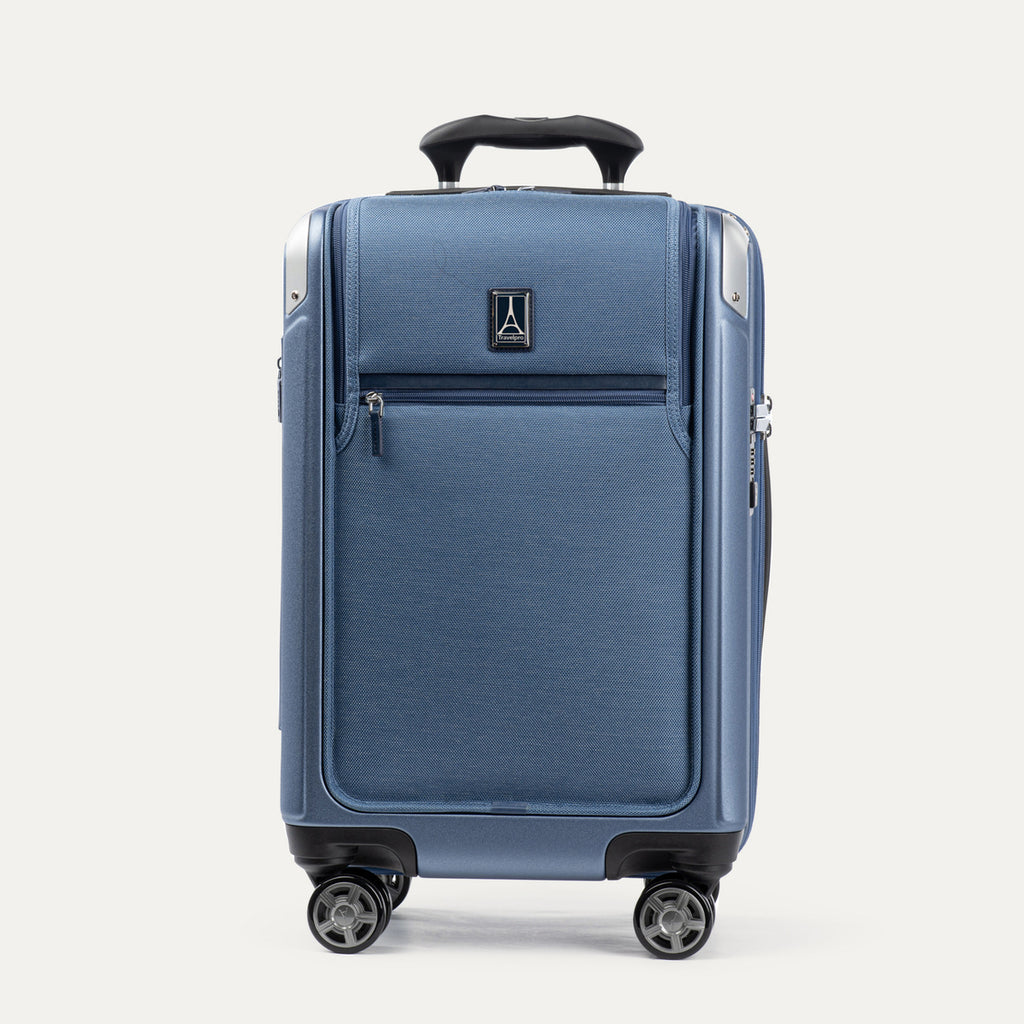 Front view of Travelpro Platinum Elite Compact Carry-On Business Plus Hardside Spinner in Dark Sky Blue, featuring a zippered front pocket and PowerScope Extension Handle.
