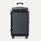 Front view of Travelpro Platinum® Elite Hardside Large Check-In Expandable Spinner in Jet Black, featuring grooved polycarbonate shell with chrome corner armor.
