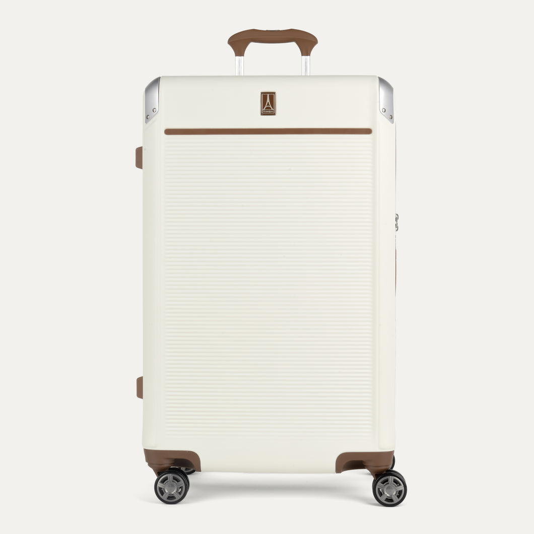 White suitcase with brown accents on a white background