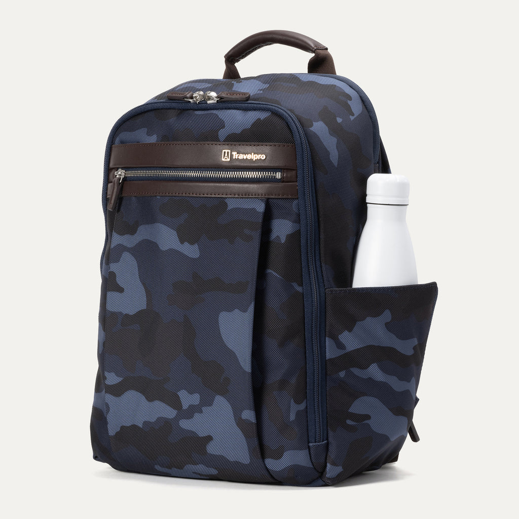 Angled front view of Travelpro Platinum Elite Slim Backpack in Navy Camouflage with zippered front pocket and side water bottle holder.
