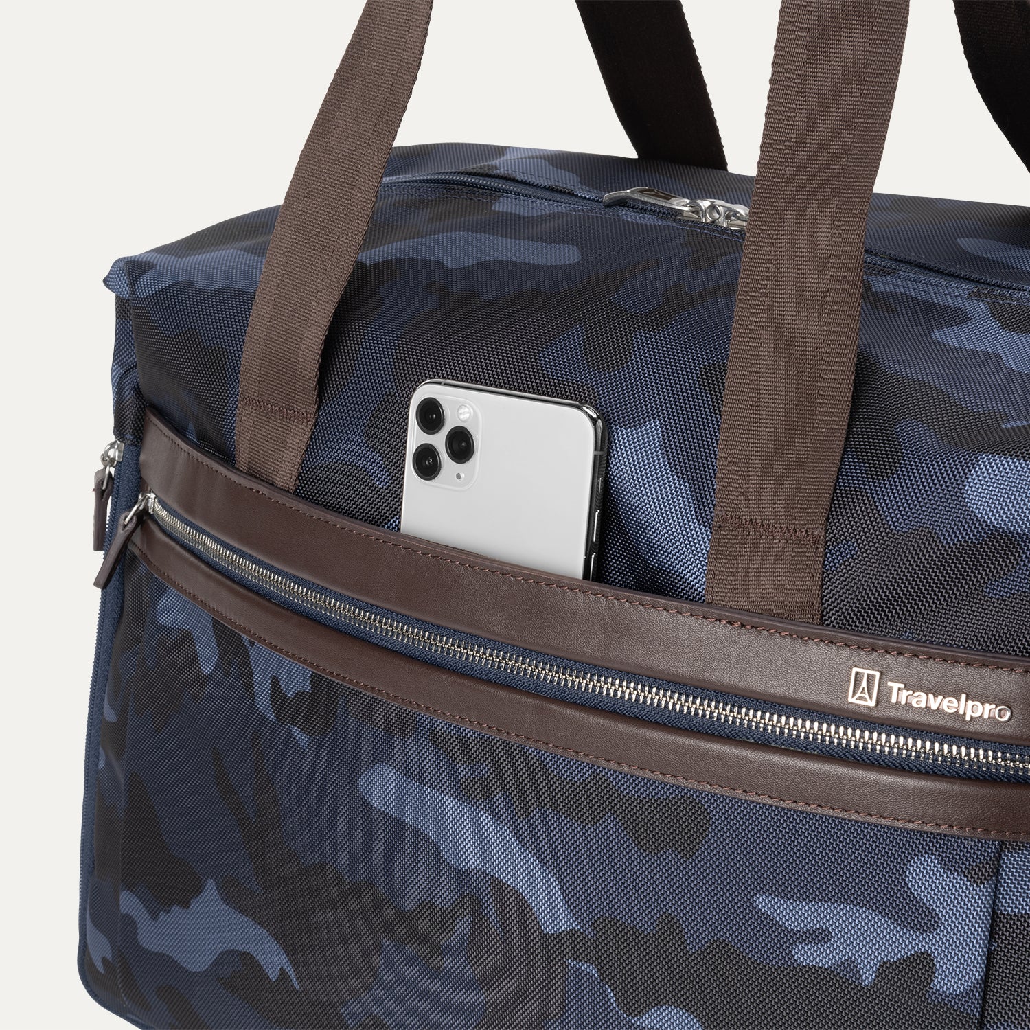  Close-up view of Platinum® Elite Soft Duffel in Camouflage, showing an exterior pocket with a smartphone partially tucked inside.
