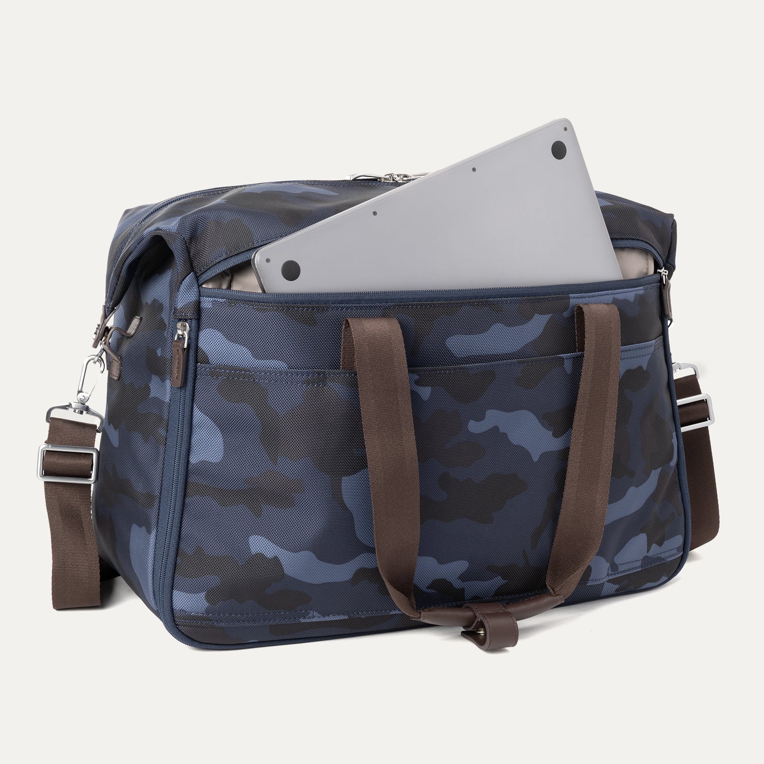 Rear view of Platinum® Elite Soft Duffel in Camouflage with brown handles, featuring a padded exterior pocket holding a laptop.

