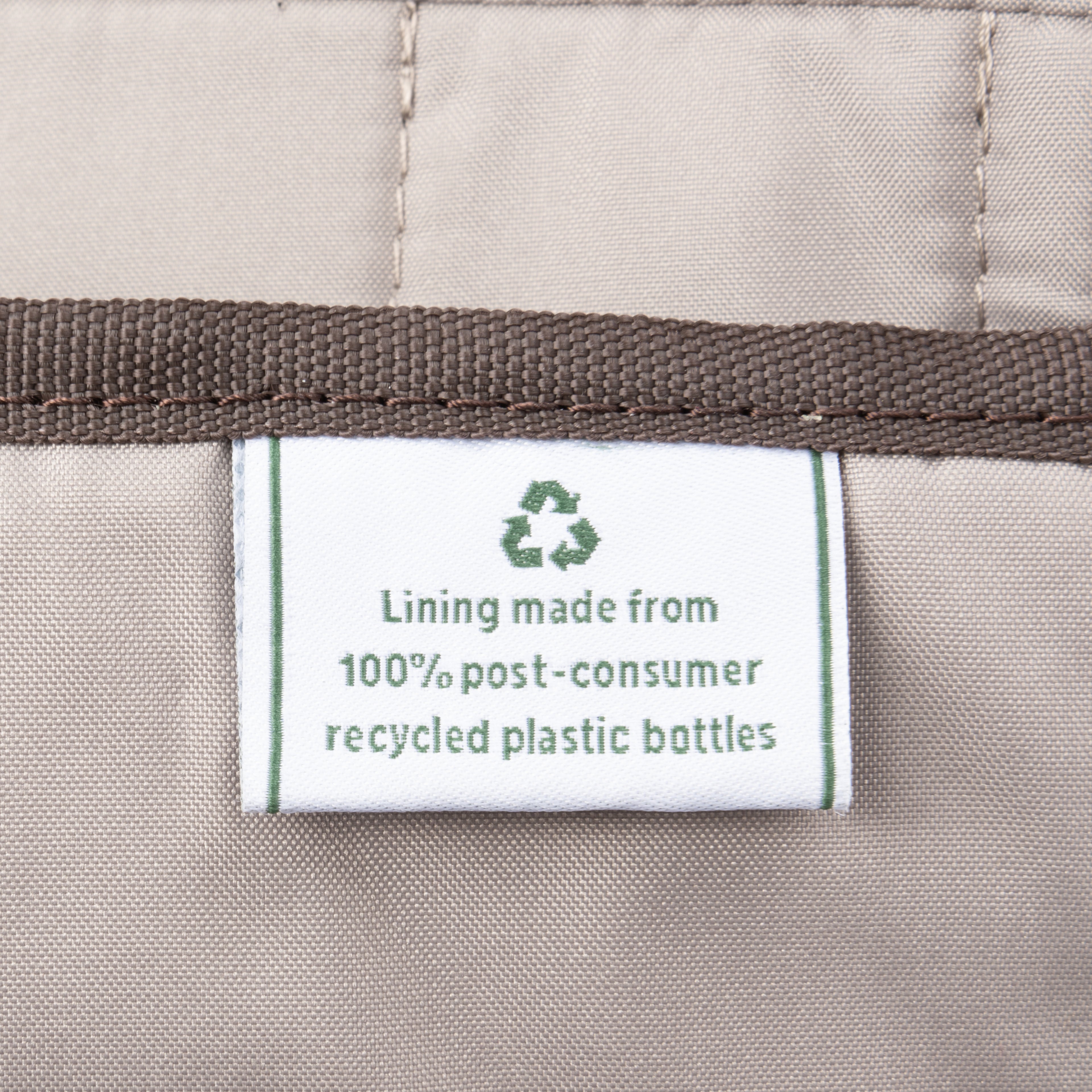 Close-up of label indicating lining made from 100% post-consumer recycled plastic bottles.
