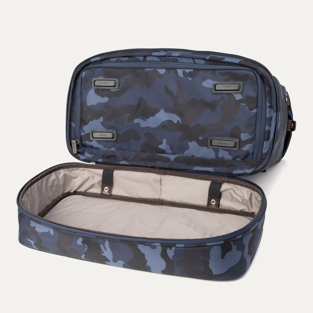 Bottom view of Travelpro Platinum Elite Drop-Bottom Weekender in Navy Camouflage with drop-bottom compartment fully unzipped.

