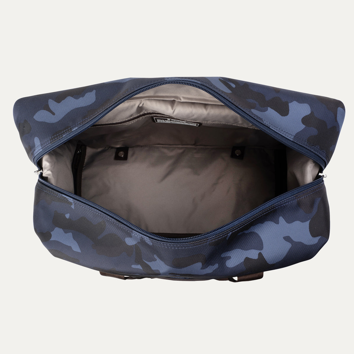 Top view of Travelpro Platinum Elite Drop-Bottom Weekender in Navy Camouflage with open main compartment and interior pocket.
