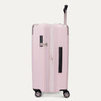Side view of the Travelpro Platinum Elite Medium Check-In Hardside Spinner in Powder Pink, shown in its expanded position to highlight the 2-inch zippered expansion feature, side carry handle, and smooth-rolling wheels against a clean off-white background.