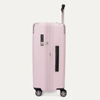 Side view of the Travelpro Platinum Elite Medium Check-In Hardside Spinner in Powder Pink, featuring a durable polycarbonate shell with polished aluminum corner armor, an extended telescopic handle, and multi-directional wheels against a clean off-white background.