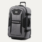 upright front three-quarter view of the gray black bold by travelpro large check-in expandable rollaboard suitcase standing vertically, showcasing its rugged black and gray polyester exterior, dual front zippered pockets, and extended telescoping aircraft-grade handle.