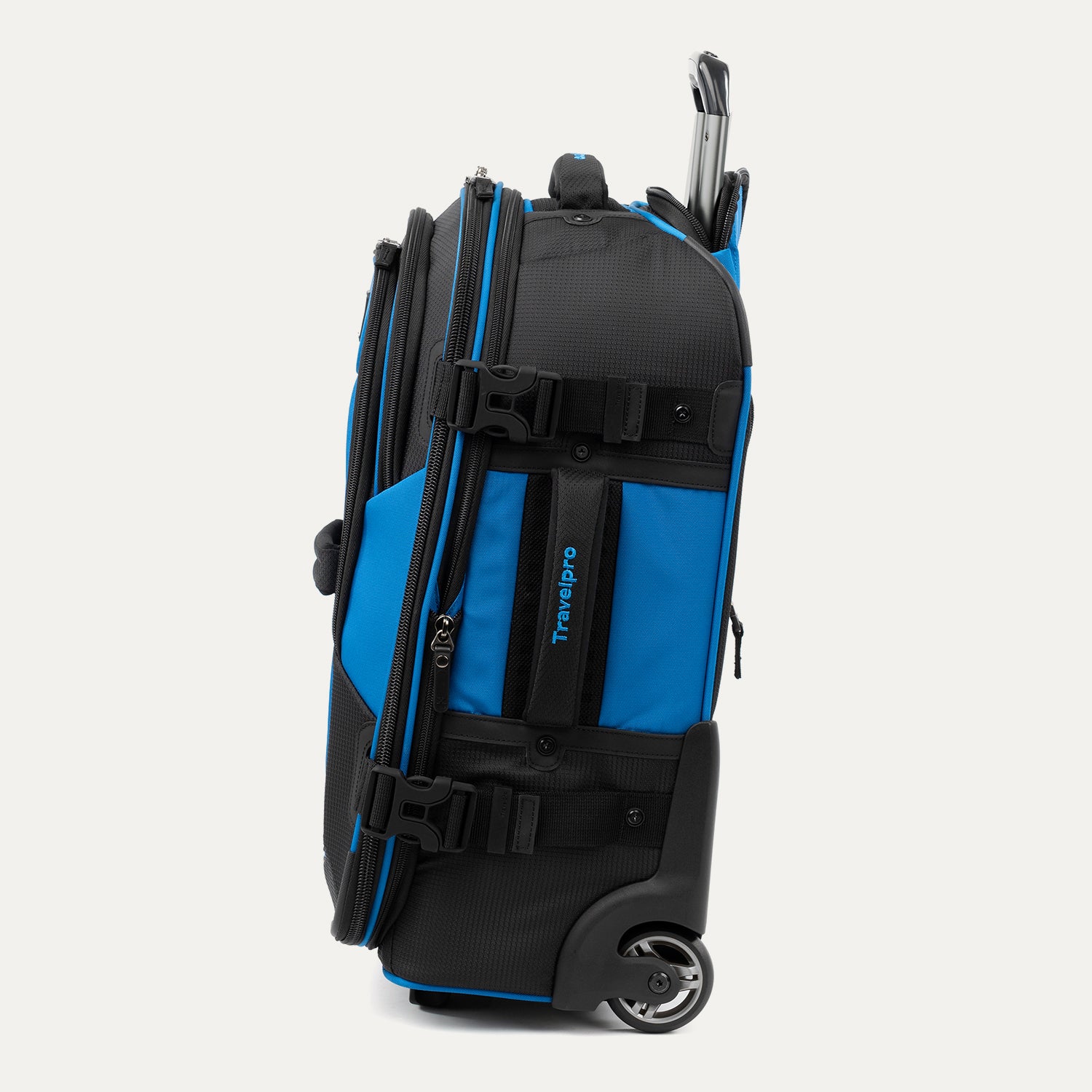 Side view of blue and black Bold™ by Travelpro® Rollaboard® with compression straps, wheel housing, and telescoping handle