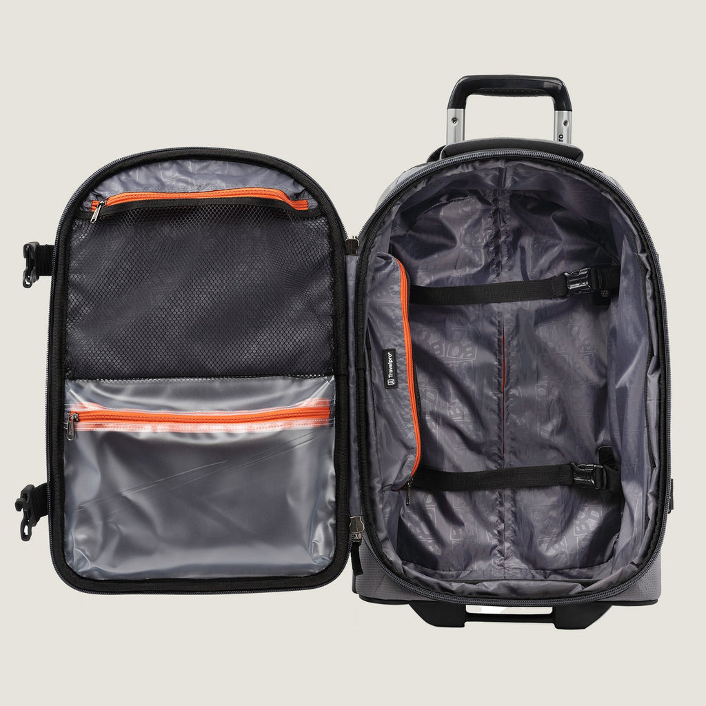 Open view of the Travelpro® BOLD™ by Travelpro® carry-on in Gray Black, showing the spacious main compartment with adjustable cross straps, multiple zippered pockets, and a telescoping handle