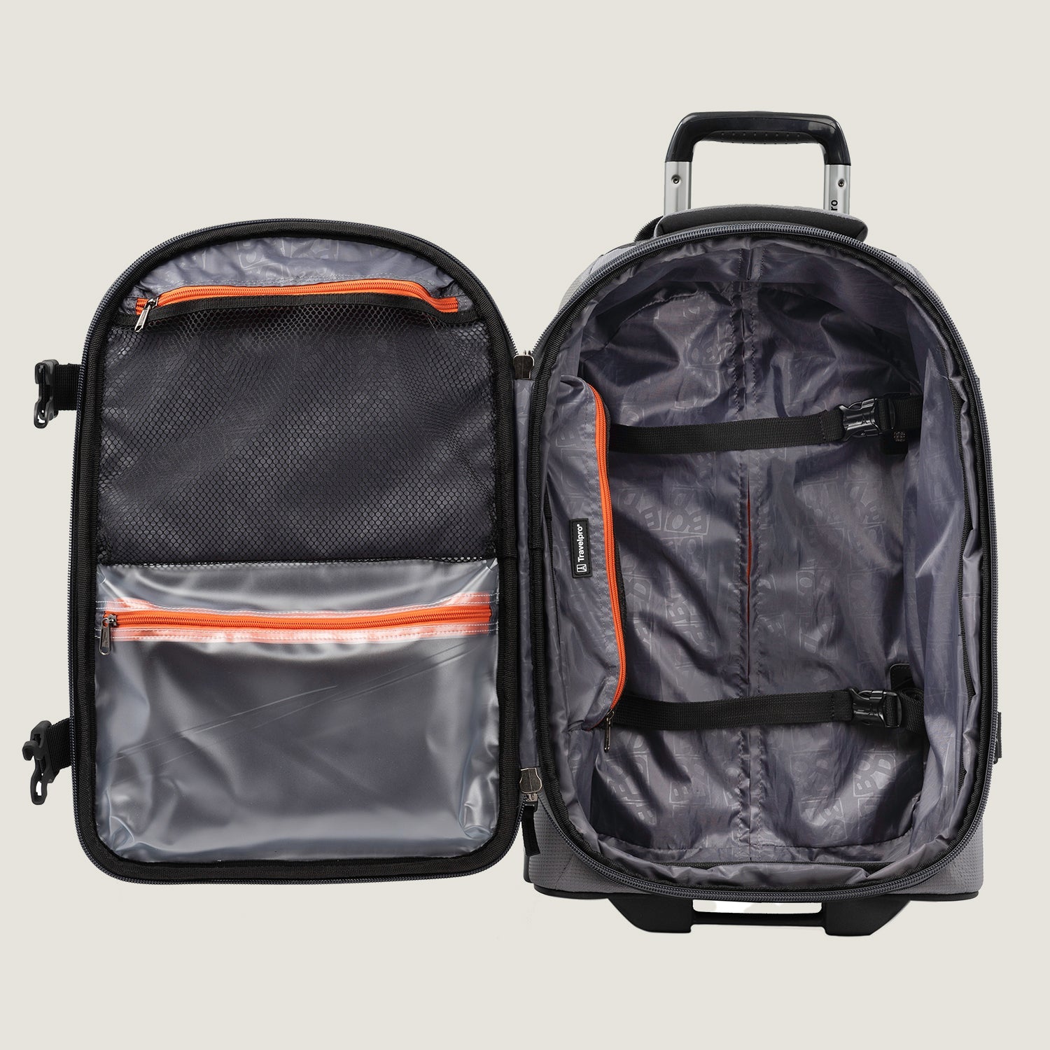 Open view of the Travelpro® BOLD™ by Travelpro® carry-on in Gray Black, showing the spacious main compartment with adjustable cross straps, multiple zippered pockets, and a telescoping handle