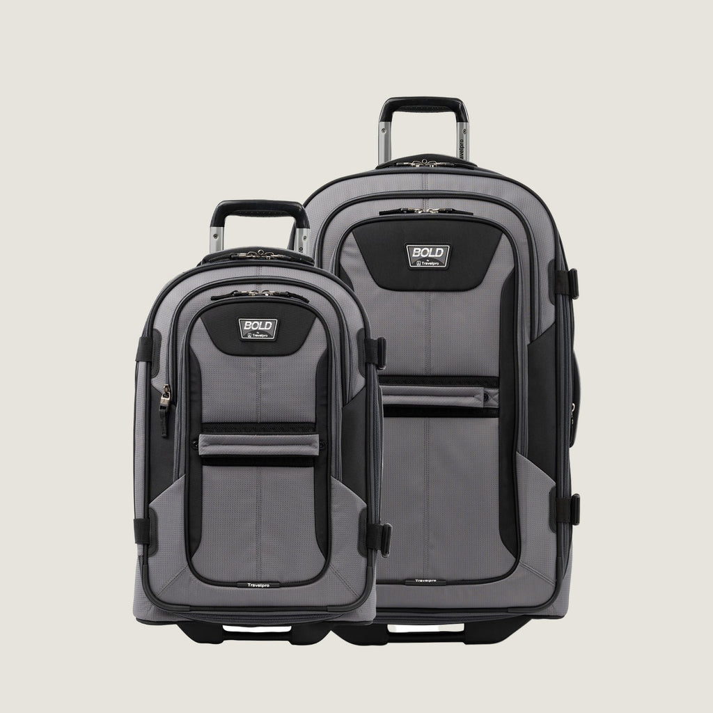 Gray and black Bold™ by Travelpro® Rollaboard® luggage set including a large check-in and a carry-on.
