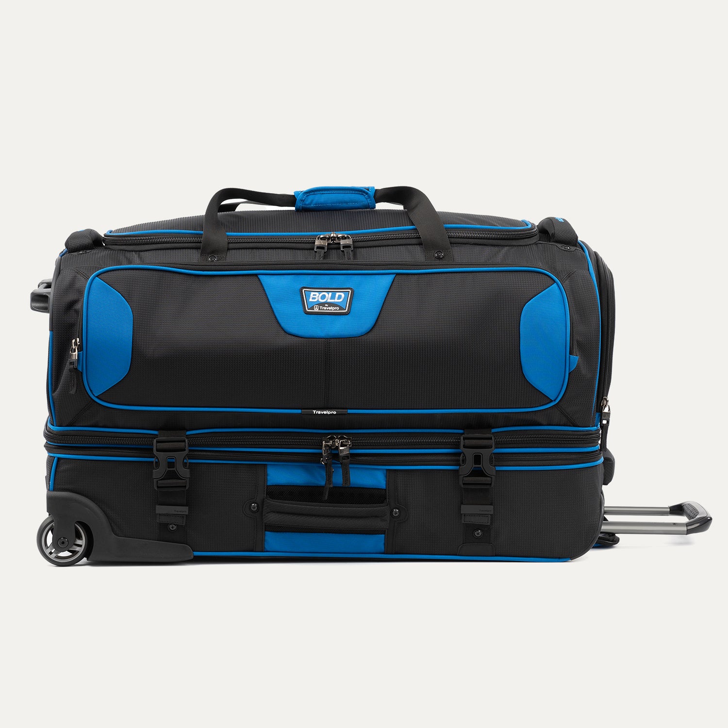 side view of the blue black bold by travelpro large check-in drop-bottom rolling duffel bag resting horizontally, showcasing its rugged exterior, dual compartment design, exterior compression straps, and sturdy inline skate wheels.
