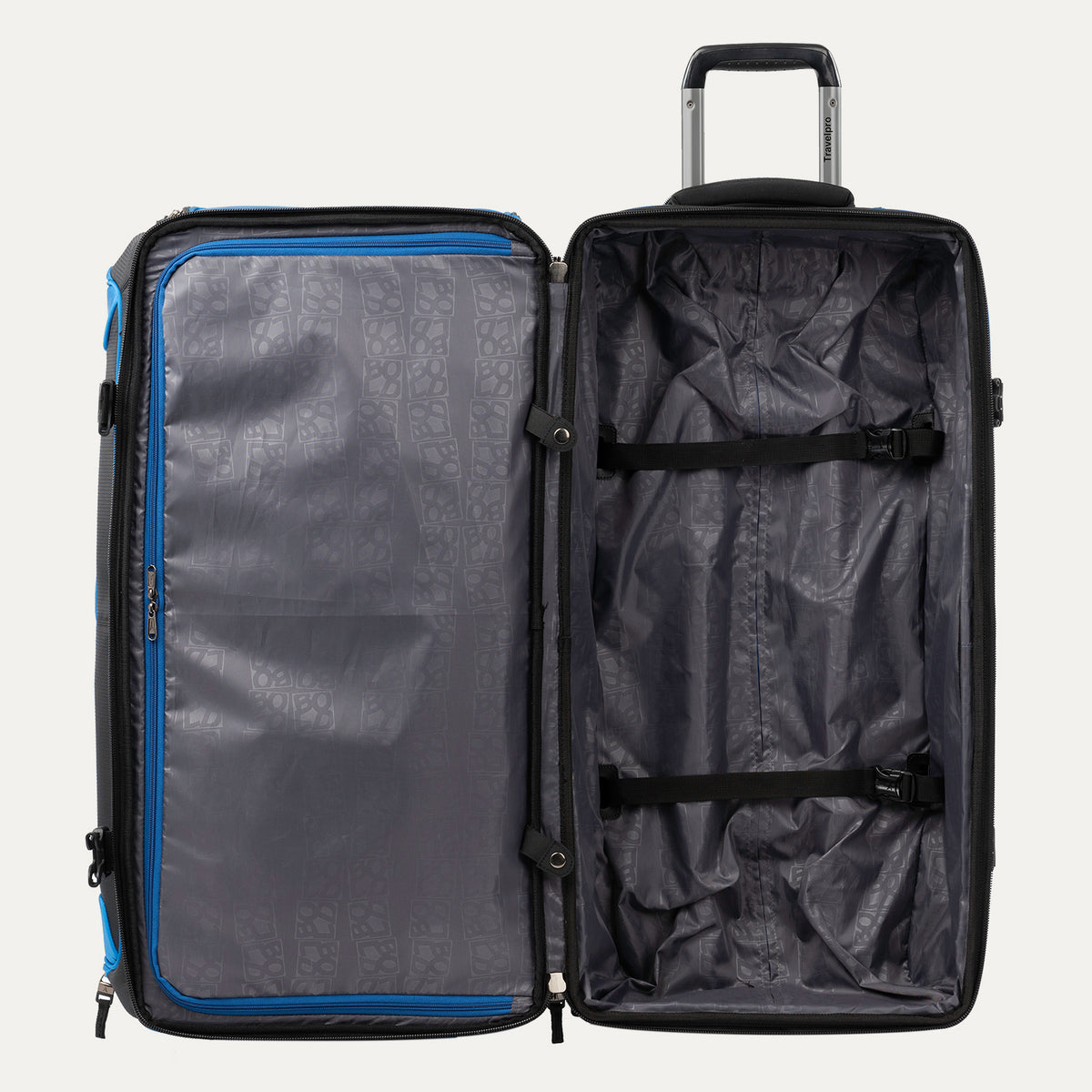 interior view of the open blue black bold by travelpro large check-in drop-bottom rolling duffel bag showing the spacious main compartment with two adjustable tie-down straps and a large zippered mesh pocket on the inside lid.