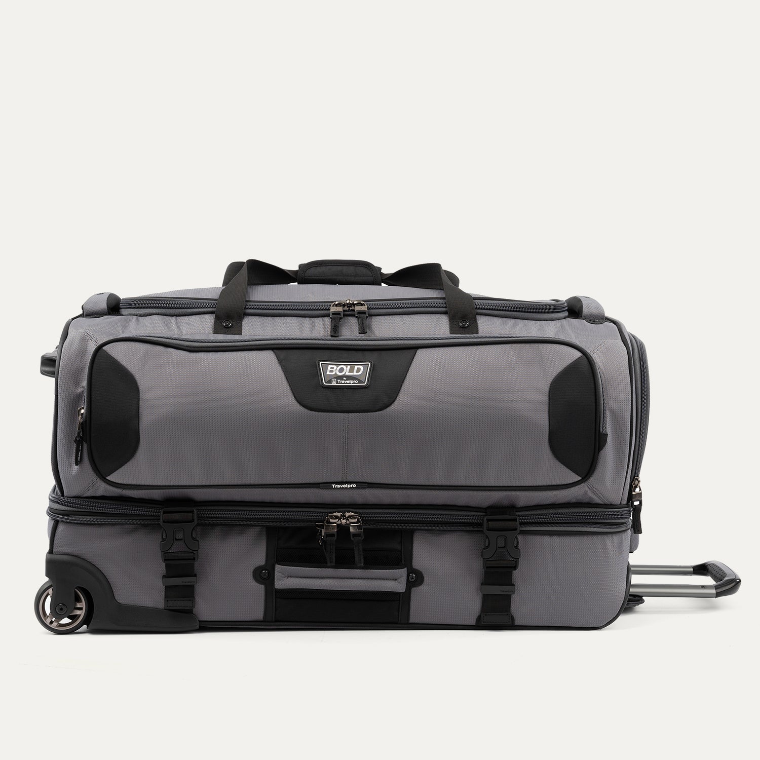 side view of the gray black bold by travelpro large check-in drop-bottom rolling duffel bag resting horizontally, showcasing its rugged polyester exterior, gray and black dual compartment design, exterior compression straps, and inline skate wheels.