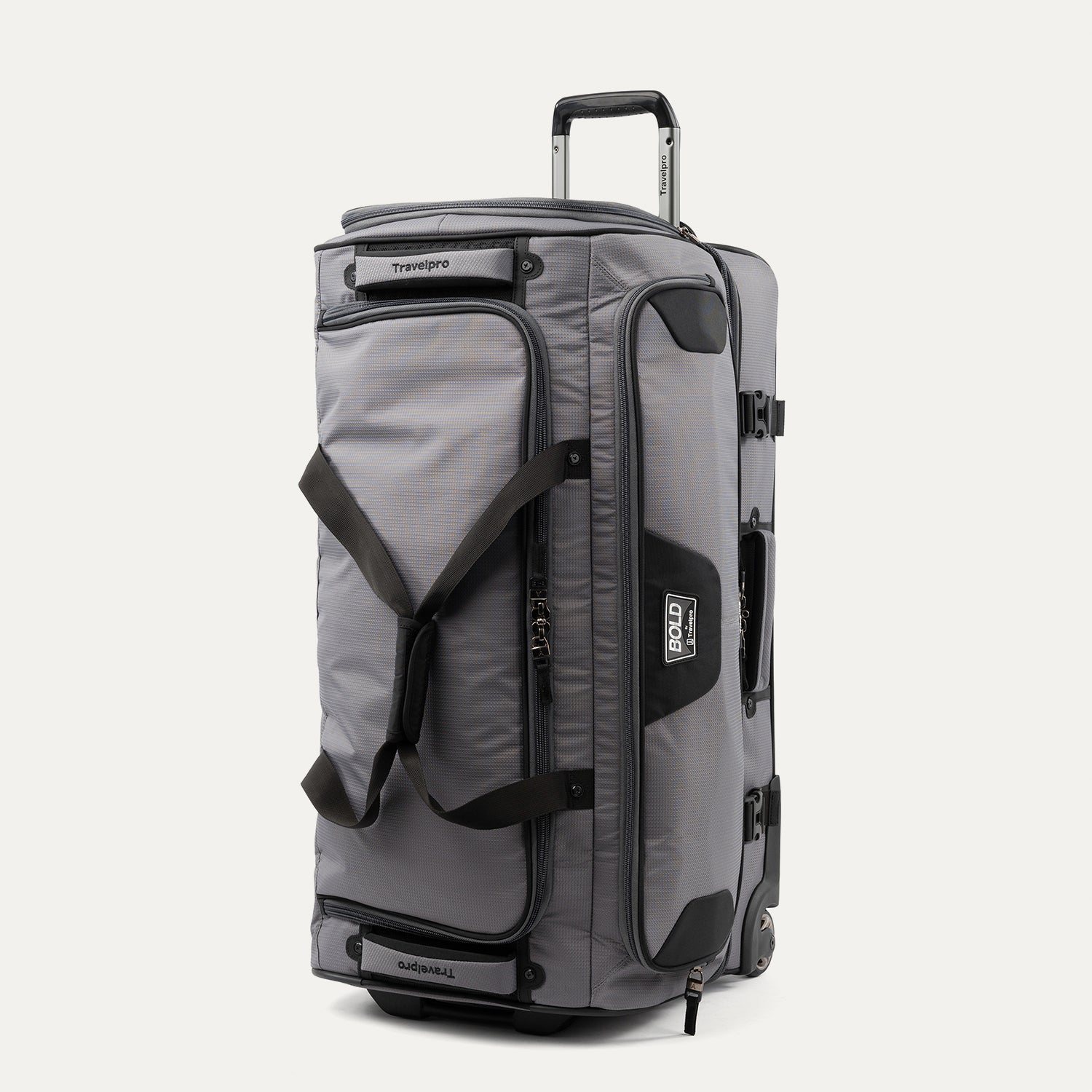 upright front three-quarter view of the gray black bold by travelpro large check-in drop-bottom rolling duffel bag standing vertically, showcasing its rugged polyester exterior, gray and black dual-tone design, dual carrying handles, and extended telescoping aircraft-grade handle.
