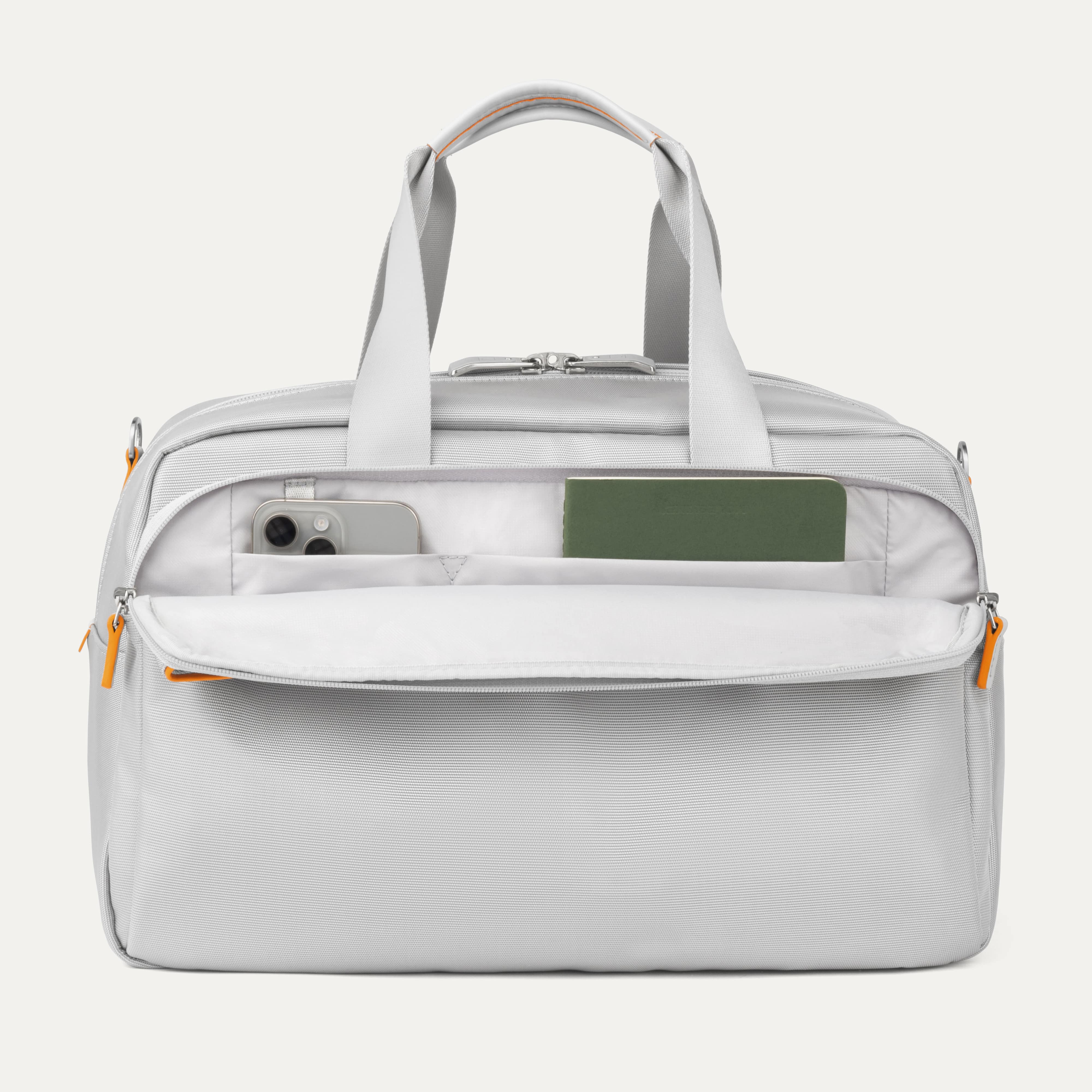 Front Pocket of VersaPack+ UnderSeat Travel Tote with Trolley Sleeve in Silver with Orange Trim