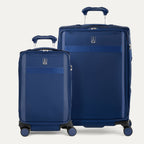 Two blue suitcases of different sizes on a white background