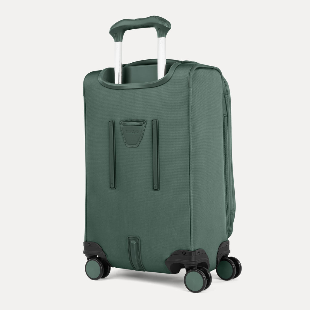 Green suitcase with wheels and handle on a white background