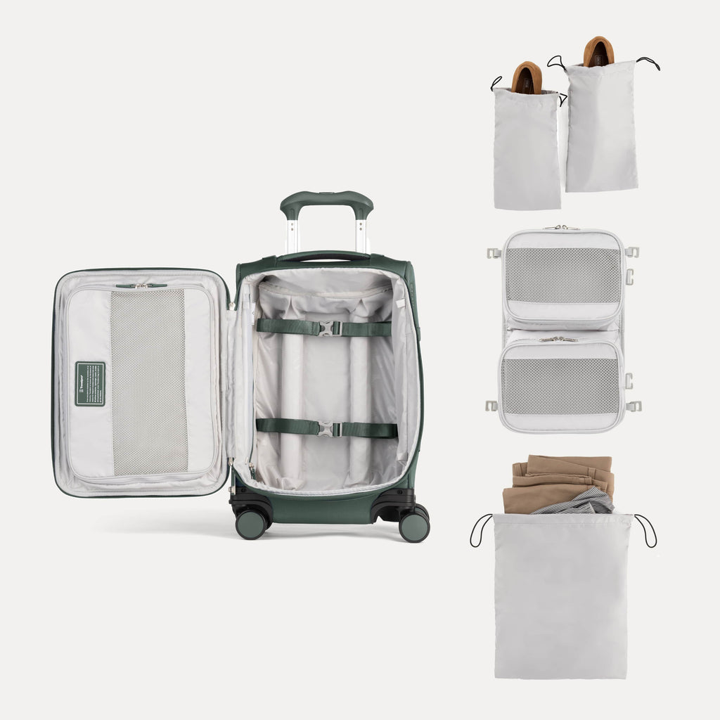 Open suitcase with travel accessories on a white background