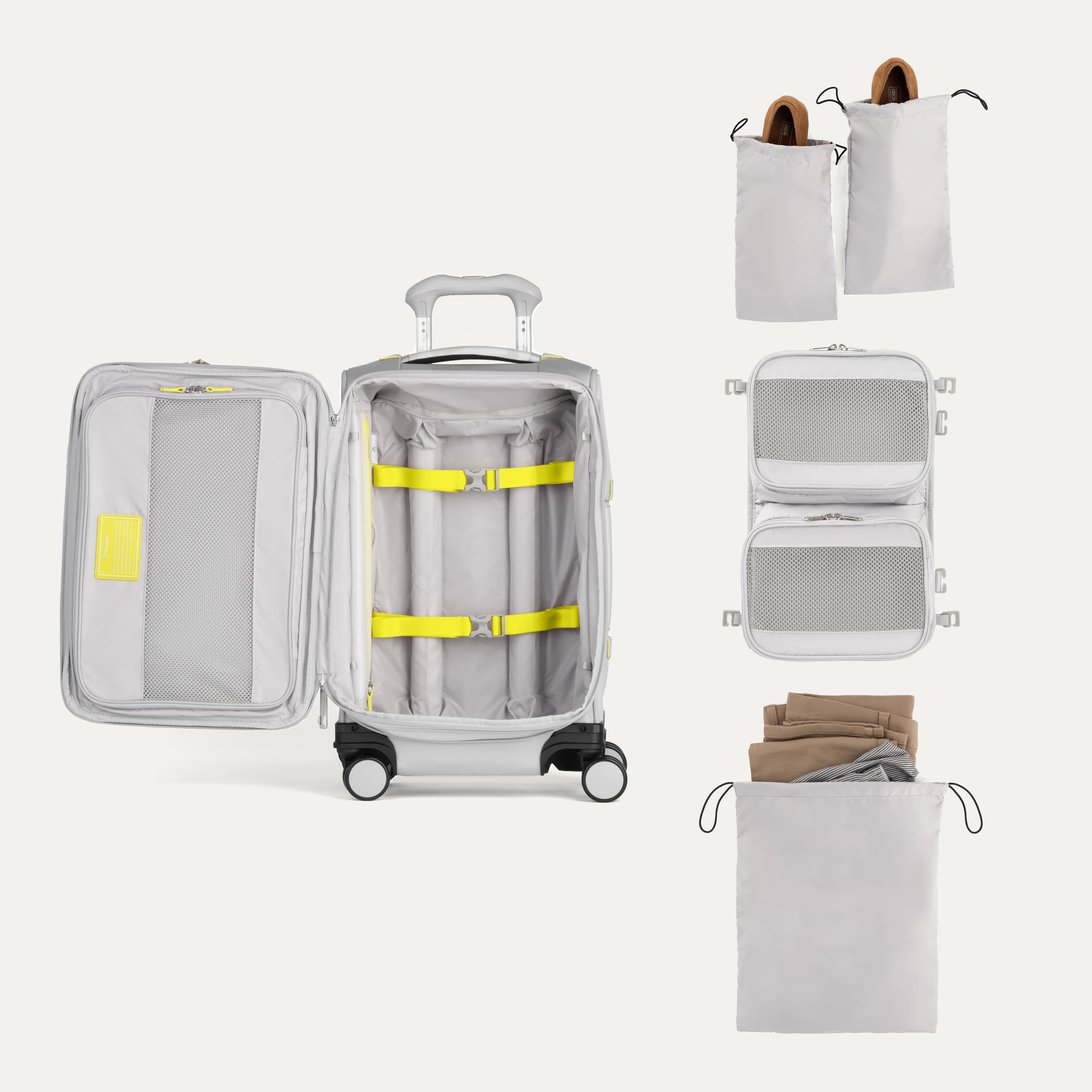 Open suitcase with travel accessories on a white background
