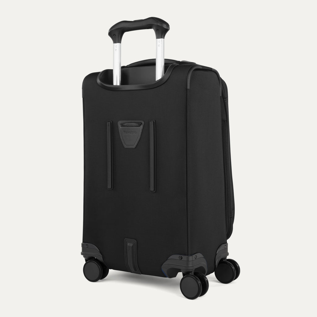 Black suitcase with wheels and handle on a white background