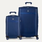 Two blue suitcases of different sizes on a white background