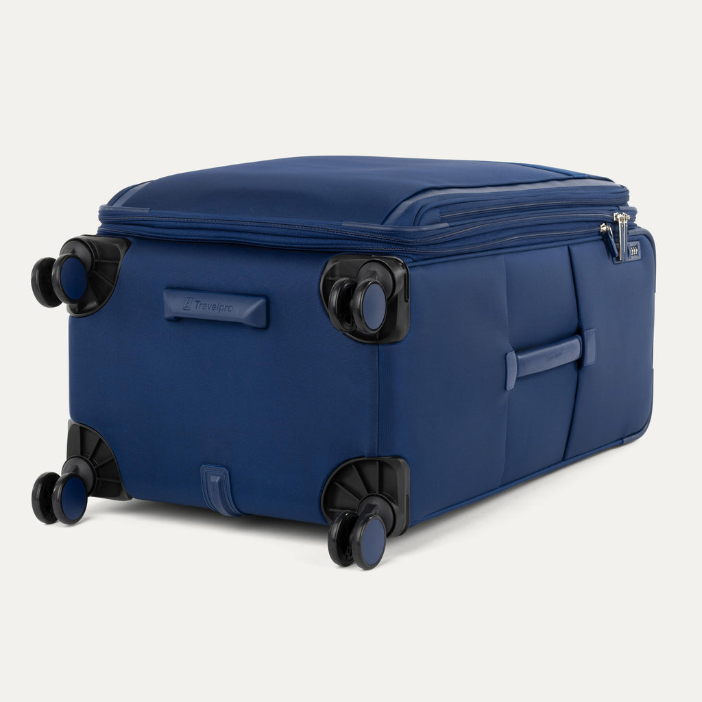 Blue suitcase with wheels on a white background