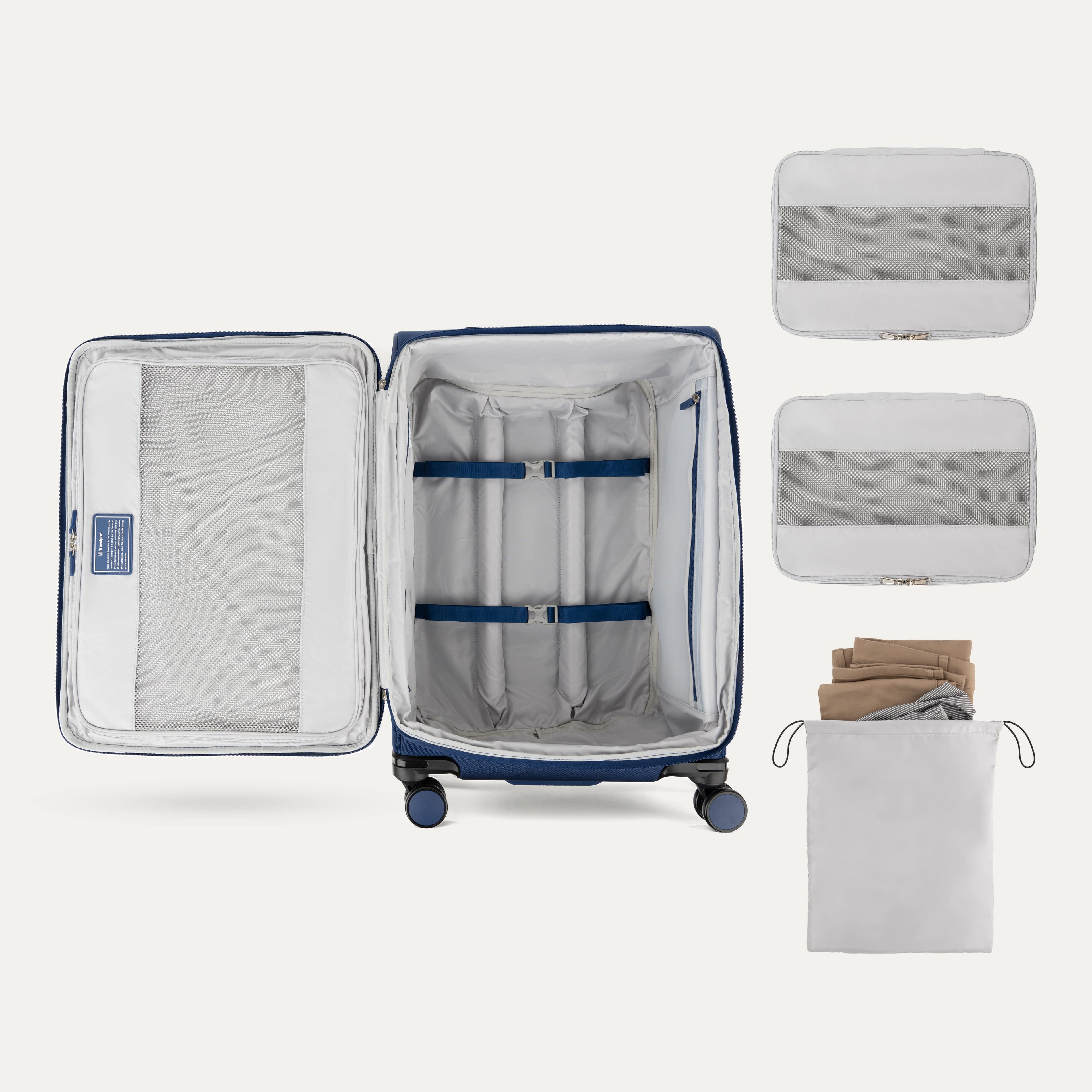 Interior of Travelpro Versapack Checked Luggage in Estate Blue, showing packing cubes, laundry bag, and adjustable hold-down straps.