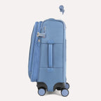 Side view of Travelpro Versapack+ Carry-On in Elemental Blue, showing a PowerScope Extension Handle and TSA Approved Locks.
