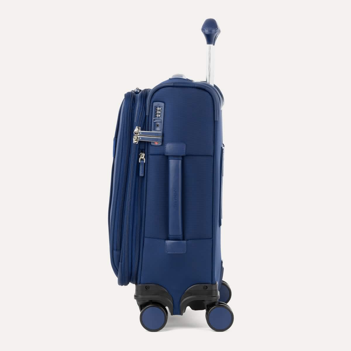 Side view of Travelpro VersaPack®+ Compact Carry-On Spinner in Estate Blue, featuring an expandable zipper, TSA-approved lock, and padded side carry handle with extended handle.