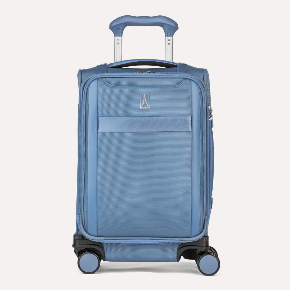 Front view of Travelpro Versapack+ Compact Carry-On Spinner in Elemental Blue, featuring front document pocket and 360° Spinner Wheels.