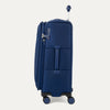 Side view of Travelpro Versapack+ Medium Check-In Spinner in True Navy, with 360° spinner wheels and PowerScope Lite handle.

