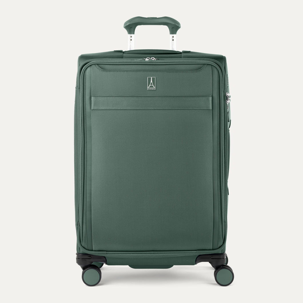Front view of Travelpro Versapack+ Medium Check-In Spinner in Slate Green, featuring 360° spinner wheels and a PowerScope Lite handle.

