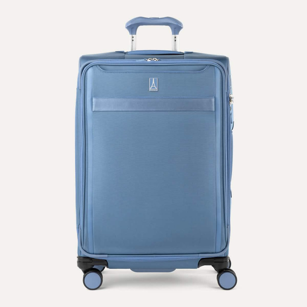 Front view of Travelpro Versapack+ Medium Check-In Spinner in Elemental Blue, featuring 360° spinner wheels and PowerScope Lite handle.
