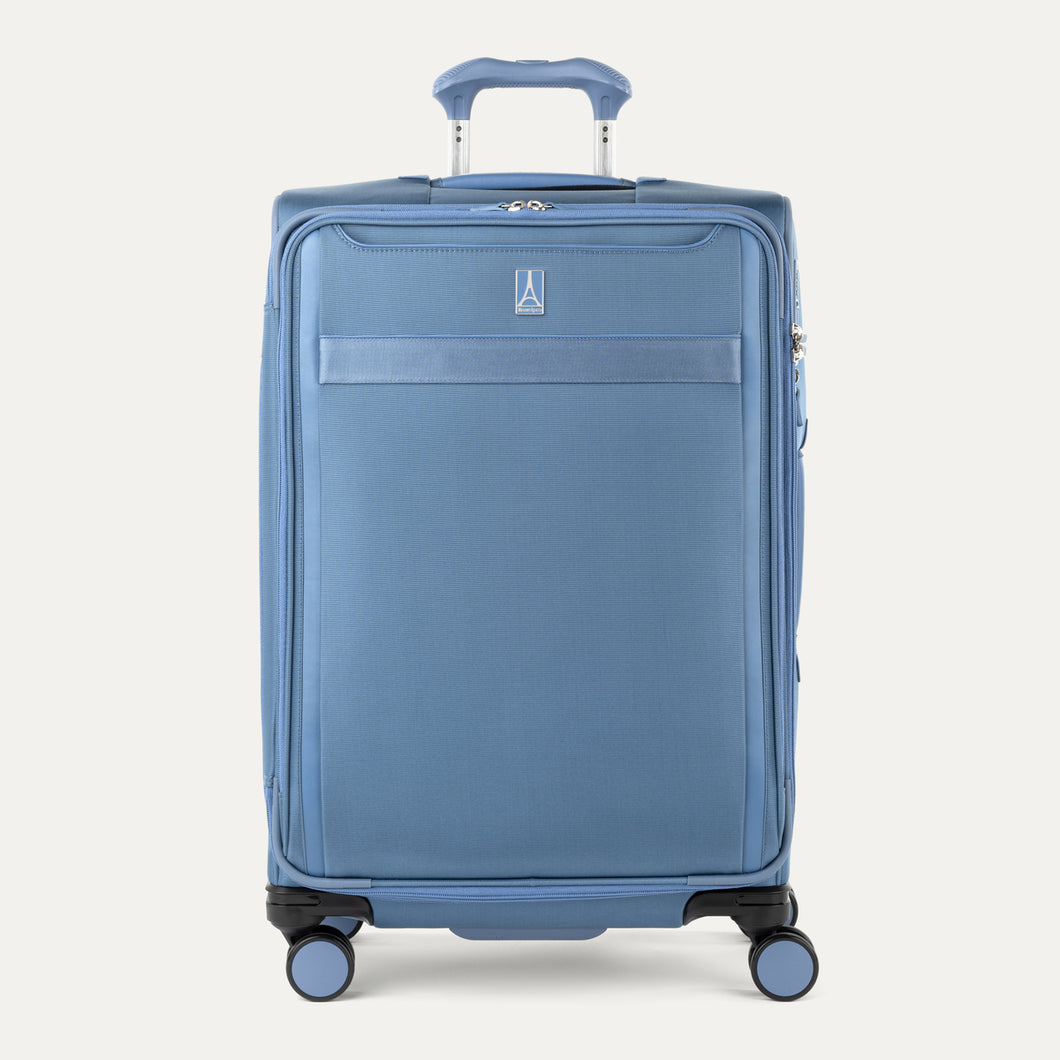 Front view of Travelpro Versapack+ Medium Check-In Spinner in Elemental Blue, featuring 360° spinner wheels and PowerScope Lite handle.
