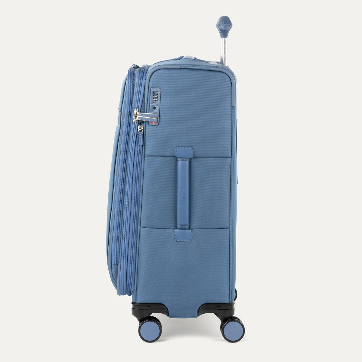 Side view of Travelpro Versapack+ Medium Check-In Spinner in Elemental Blue, showing 360° spinner wheels and PowerScope Lite handle.

