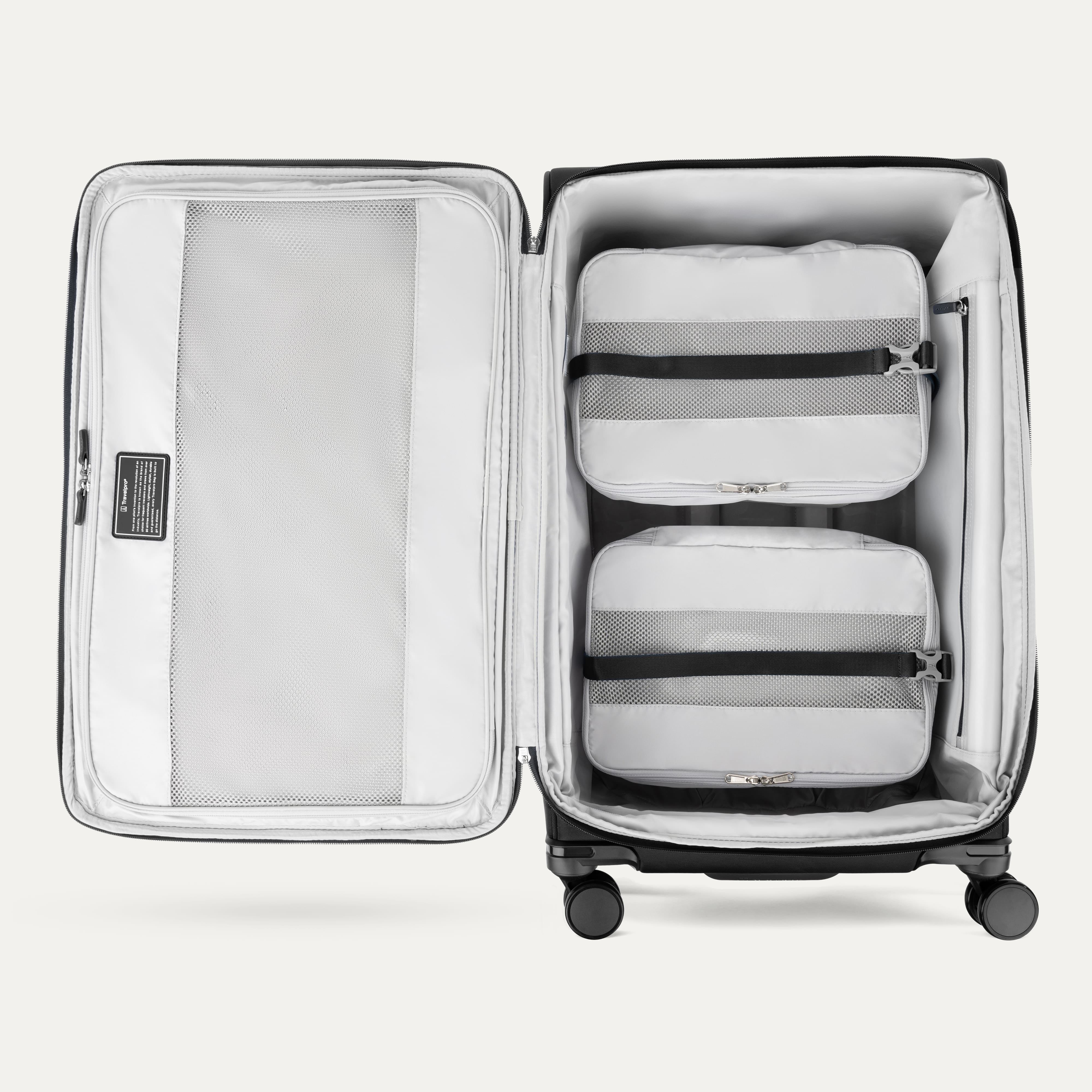 Water Resistant Interior of Black VersaPack+ Extra Large Checked Luggage Spinner with Compression Packing Organizers