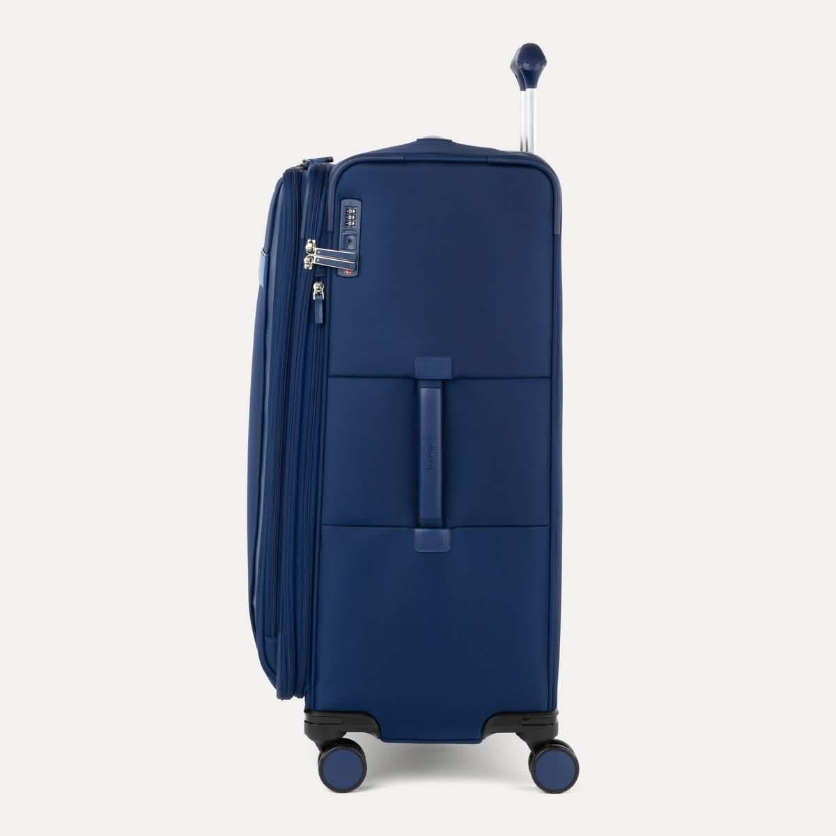 Side view of Travelpro VersaPack+ Large Check-In Spinner in Estate Blue, showing Contour Grip handle and 360° spinner wheels.
