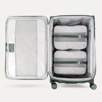 Interior of Green VersaPack+ Extra Large Checked Luggage Spinner with Compression Packing Cubes and Accessories