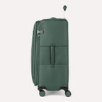 Side view of Travelpro VersaPack+ Large Check-In Spinner in Desert Sage Green, showing 360° spinner wheels and Contour Grip handle.
