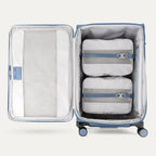 Water Resistant Interior of Baby Blue VersaPack+ Extra Large Checked Luggage Spinner with Compression Packing Organizers