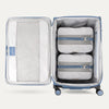 Water Resistant Interior of Baby Blue VersaPack+ Extra Large Checked Luggage Spinner with Compression Packing Organizers